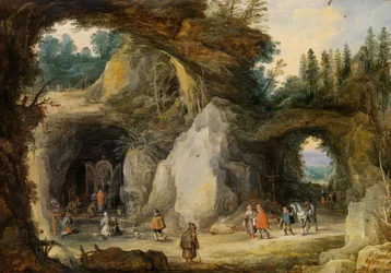 Ein Einsiedler vor einer Grotte